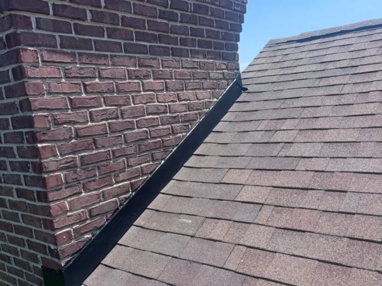 Completed chimney flashing and adjacent shingle repair in Fishers, Indiana