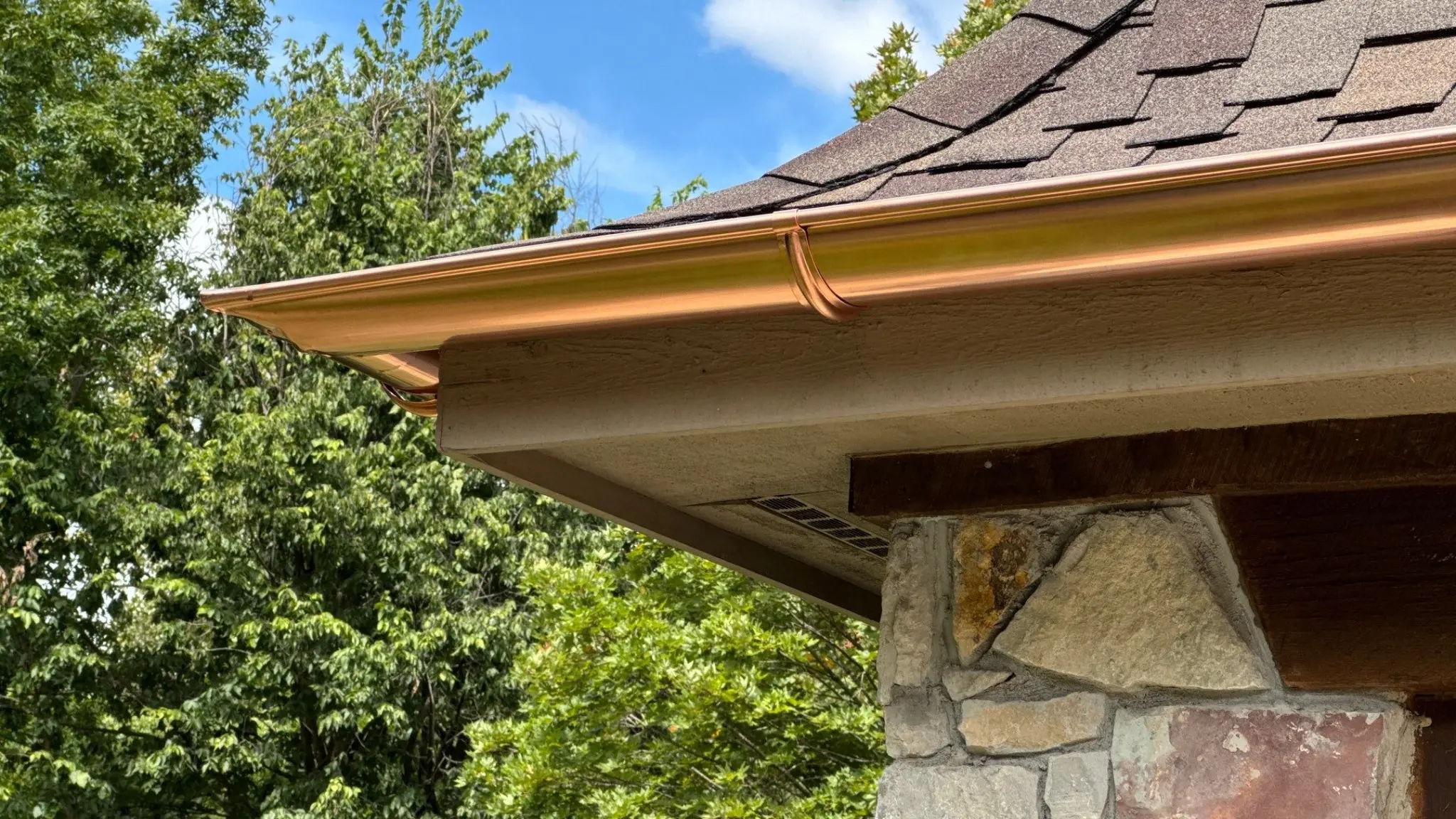 Copper gutter detail beneath CertainTeed Presidential Shake shingles on a Fishers, Indiana home