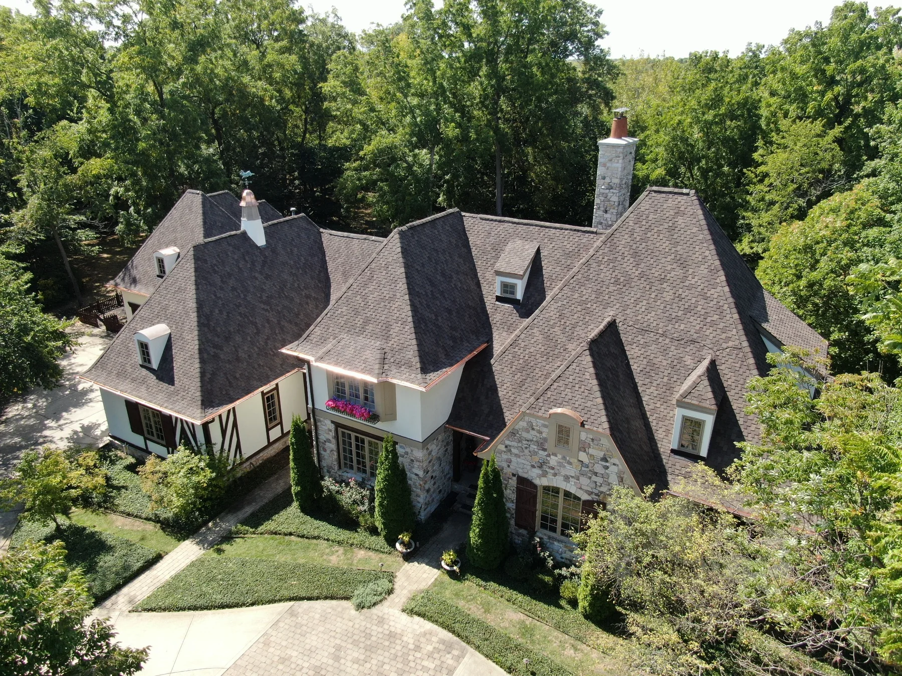 Large CertainTeed Presidential Shake roof with custom copper details on Fishers home