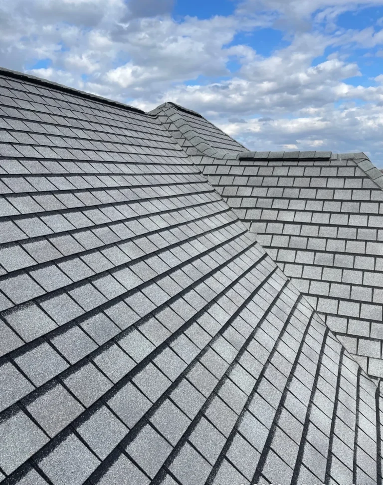 Metal valley flashing detail with GAF Camelot II shingles on a Noblesville, Indiana roof